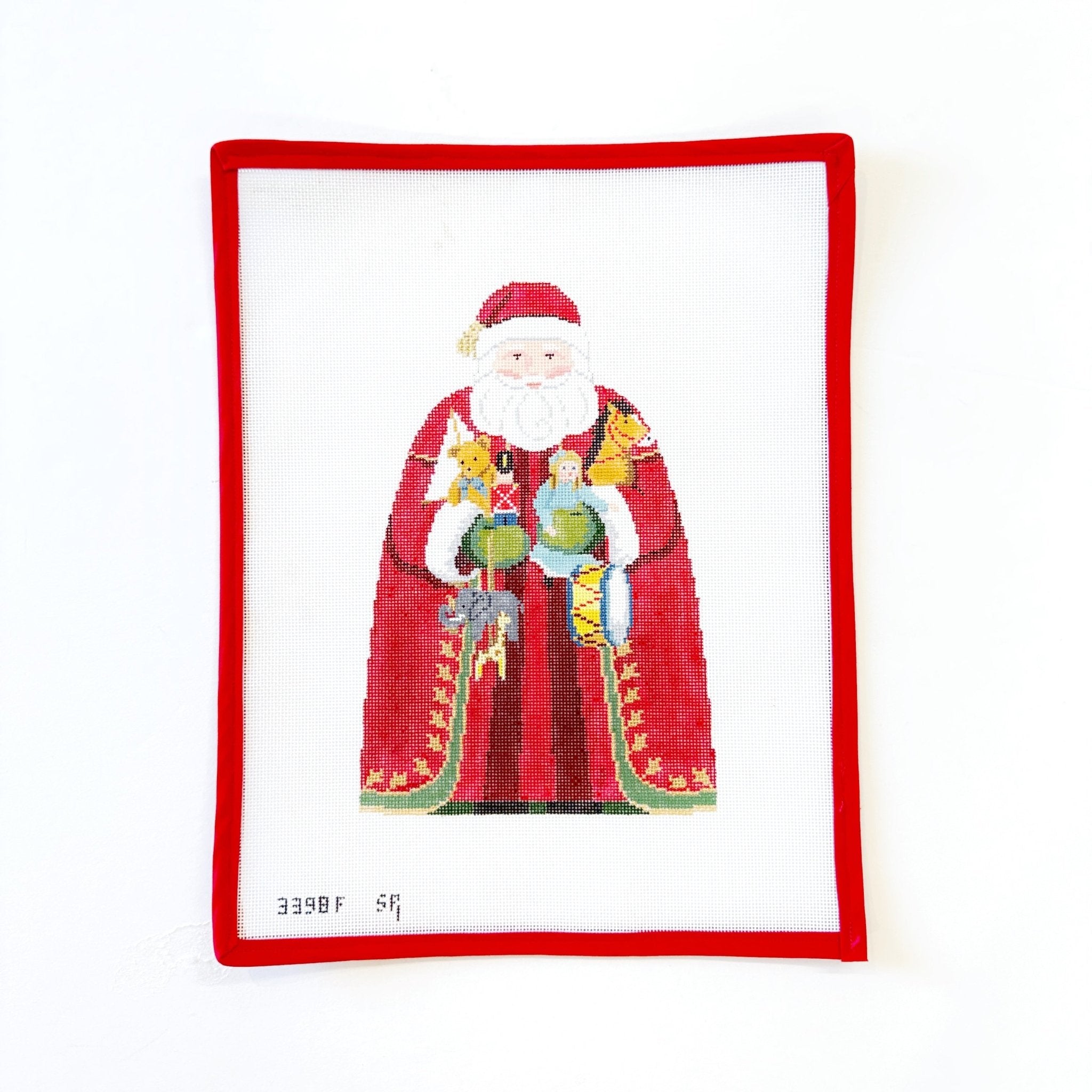 Santa with Toys Tree TopperSusan RobertsCanvasThe Red Thread Atelier