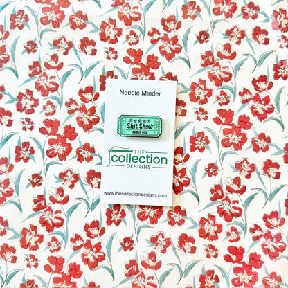 Sh!t Show Ticket Needle minderThe Collection DesignsNeedleminderThe Red Thread Atelier