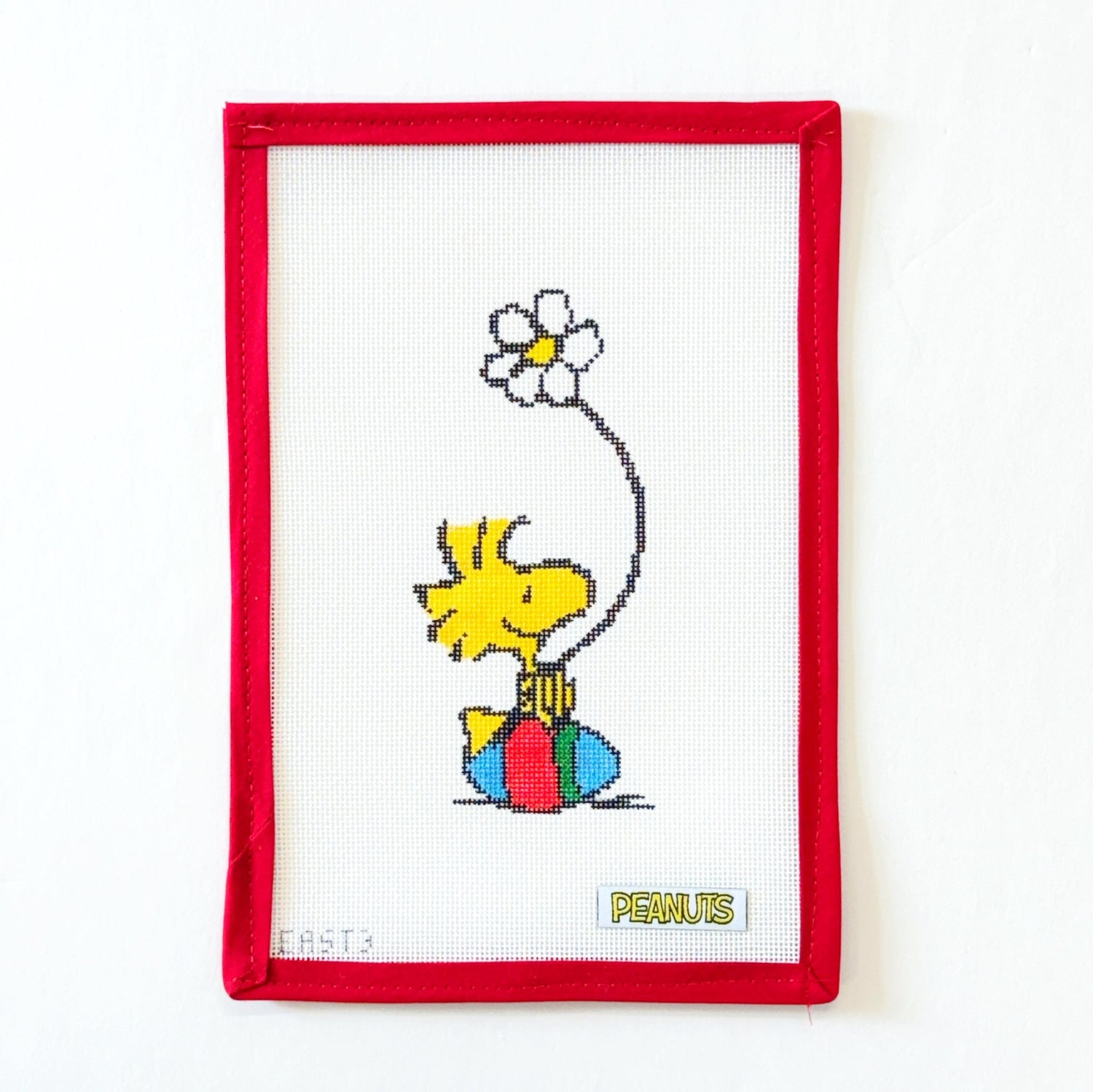 Woodstock Sitting on Easter Egg with Daisy - PeanutsOfficially NeedlepointCanvasThe Red Thread Atelier